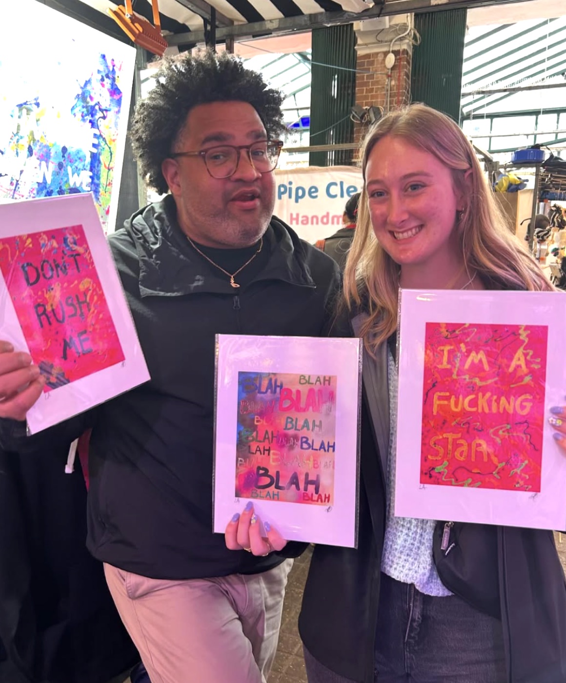 A collector with Don't Rush Me, Blah Blah + I'm A F*cking Star at Luis Alvarez's stall