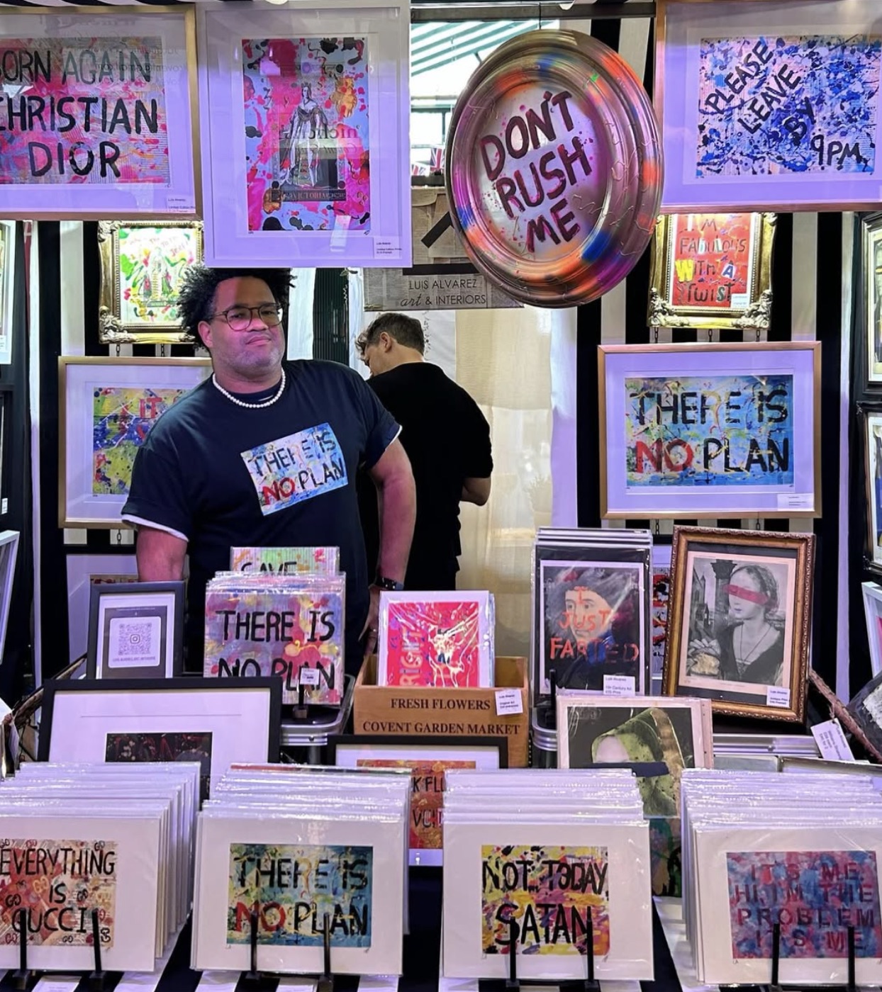 Luis behind the print racks